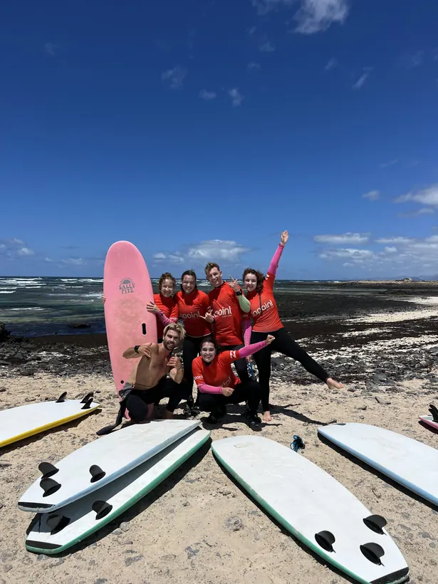 Surf group with Lapoint instructors and boards on the beach